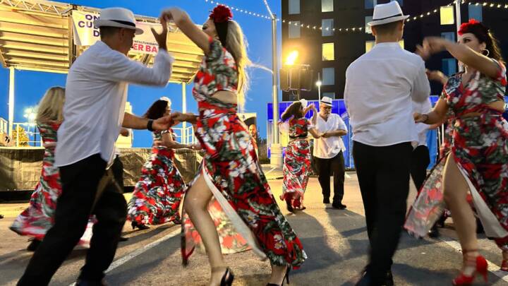 People dancing a traditional dance at dusk